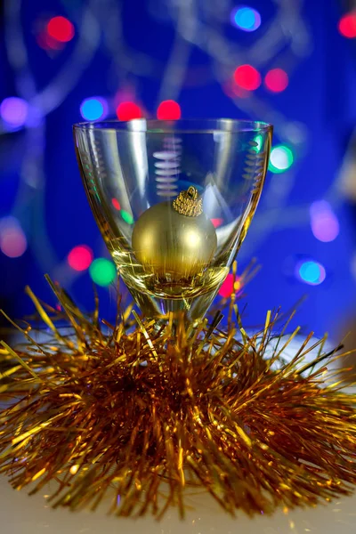 Wine glass with a yellow ball Stock Image