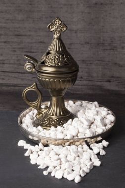 Greek Ortodox church incense and burner in Athonite style. In the tradition of Mt. Athos (The Holy Mountain), it begins with pure frankincense tears, added fragrance and aromatic wood resins. clipart