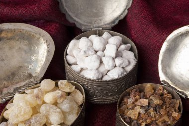 Frankincense is an aromatic resin, used for religious rites, incense and perfumes. High quality frankincense resin from Dhofar, Oman, Myrrh from Ethiopia and Greek Ortodox incense  clipart