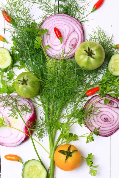 Cover for a cookbook magazine dill and coriander chilli tomato cucumber red onion on a white wooden background style flat top view