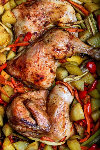 Baked chicken legs with vegetables Stock Photo