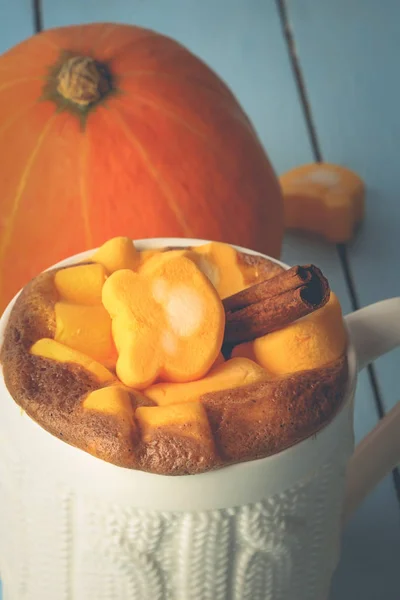 autumn drink. hot pumpkin smoothie with chocolate and marshmallows