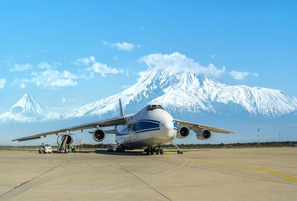 Russian Ruslan cargo plane at the airport of Yerevan (Armenia, Mrcah 2015) against the backdrop of Mount Ararat 