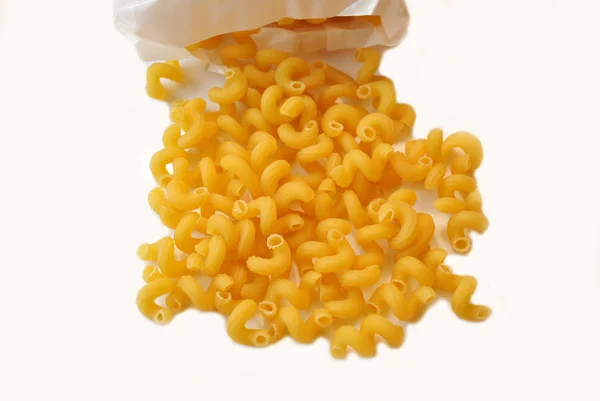 Cavatappi Spilling From a Package Over White — Stock Photo, Image