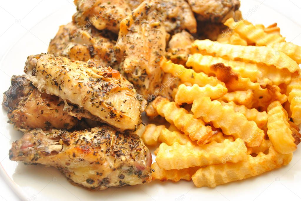 Spicy Chicken Wings Served with French Fries