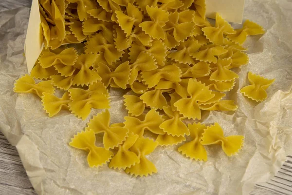 Penne Pasta pouring from the box — Stock Photo, Image