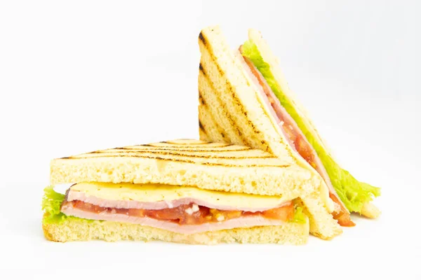 Sandwich with ham, cheese, tomatoes, lettuce, and toasted bread. — Stock Photo, Image