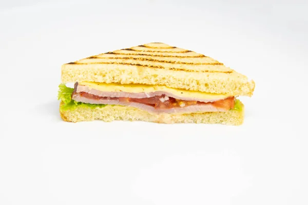 Sandwich with ham, cheese, tomatoes, lettuce, and toasted bread. — Stock Photo, Image