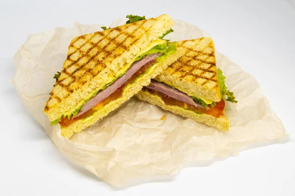 Sandwich with ham, cheese, tomatoes, lettuce, and toasted bread. — Stock Photo, Image