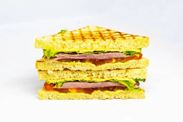 Sandwich with ham, cheese, tomatoes, lettuce, and toasted bread. — Stock Photo, Image