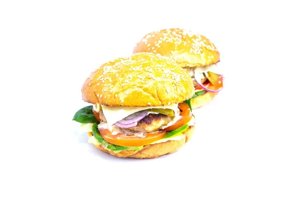 Dois hambúrgueres isolados sobre um fundo branco — Fotografia de Stock