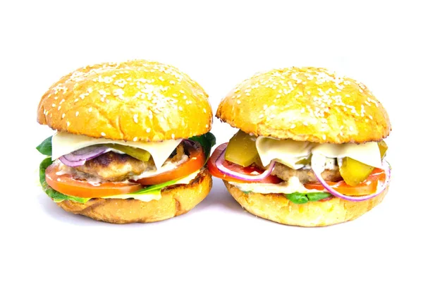 Dos hamburguesas aisladas sobre un fondo blanco —  Fotos de Stock