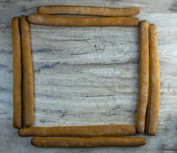 Pile of breadsticks or grissini square shape square view — Stock Photo, Image