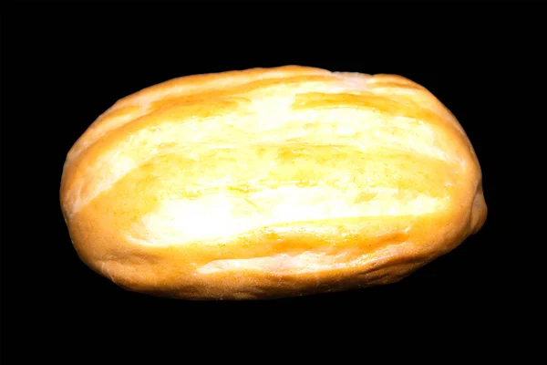 A loaf of white bread is insulated against a black background. — 스톡 사진