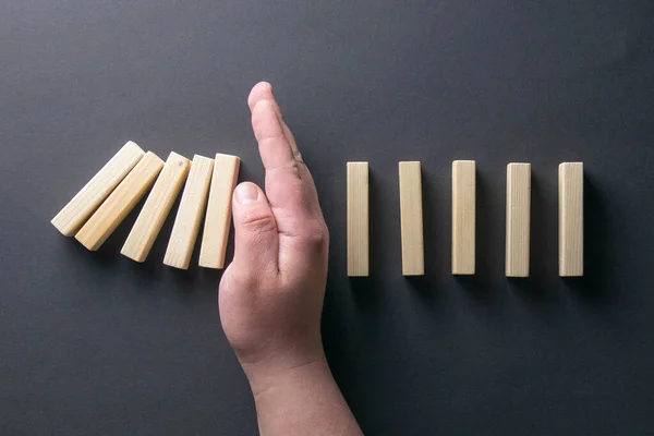 Top View Man Hand Stopping Falling Dominos Business Crisis Concept — Φωτογραφία Αρχείου