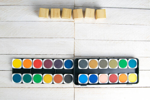 Top view on colorful paints and brushes. Creative ideas, creativity and early learning. Education concept.