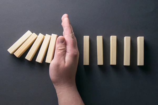 Top View Man Hand Stopping Falling Dominos Business Crisis Concept — Φωτογραφία Αρχείου