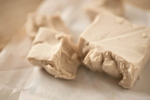 Fresh yeast and flour on table — Stock Photo, Image