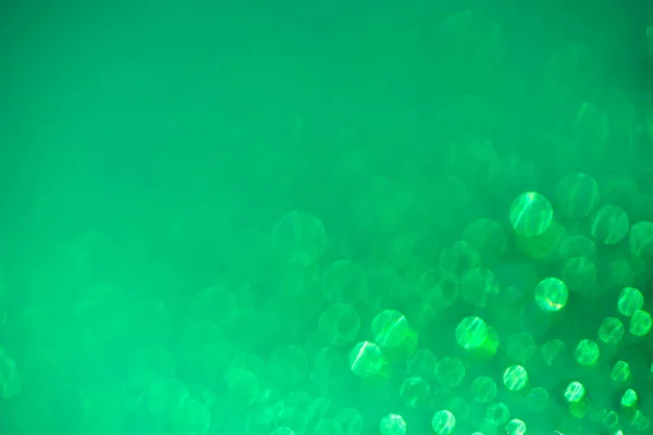 Groene intreepupil onscherpe achtergrond textuur met bokeh — Stockfoto