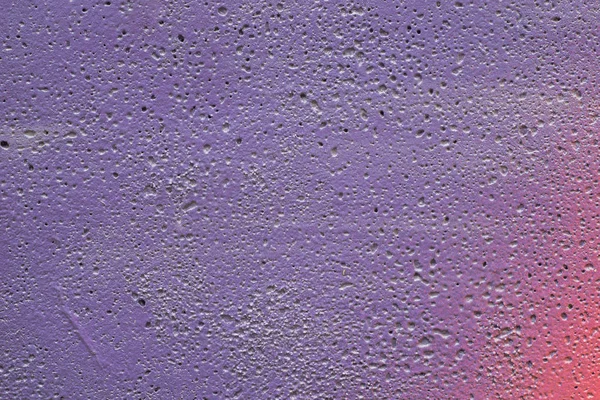 lilac painted wall texture background - detail of graffiti