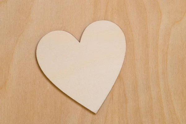 Wooden heart shape on wood background — Stock Photo, Image