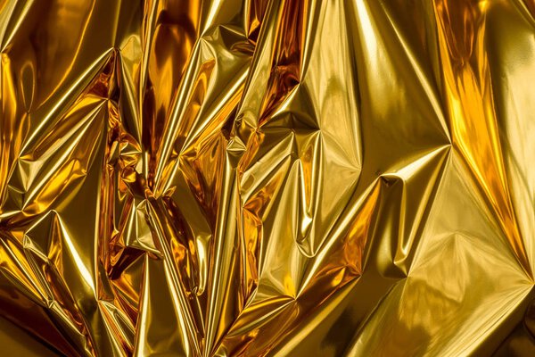 golden folded metallic foil abstract bacgkground 