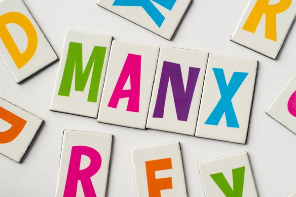 Slovo Manx vyrobené z barevných písmen — Stock fotografie
