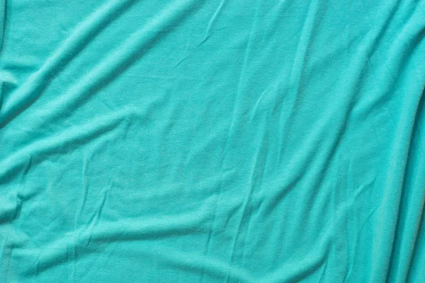 turquoise creased cotton fabric background texture