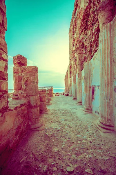 Abandoned place. The ruins of the palace of King Herod\'s Masada at sunset. Israel. View of Dead sea. Vintage color