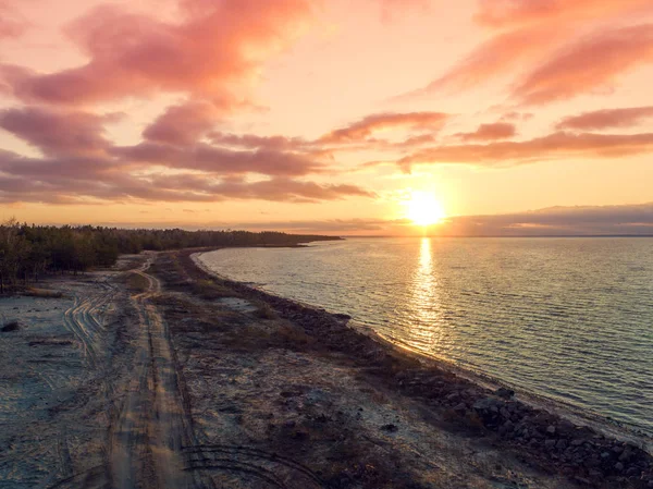 Sunset over the sea. Sea landscape in the evening. Beautiful sunset with dramatic sky. Aerial view