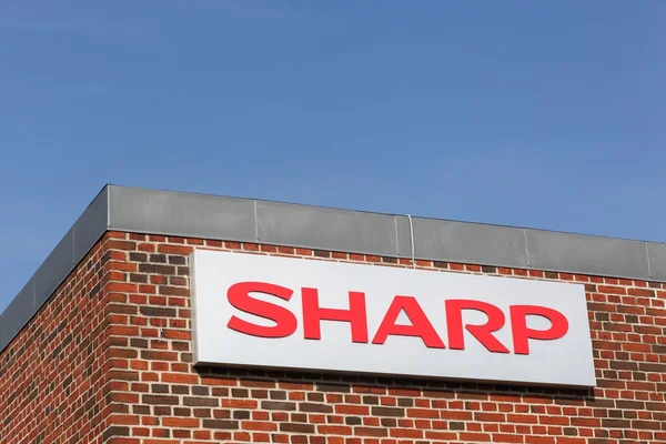 Sharp logo on a facade — Stock Photo, Image