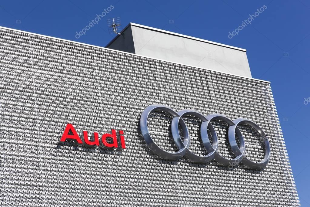 Lyon, France - July 3, 2016: Audi logo on a wall. Audi is a German automobile manufacturer that designs, engineers, produces, markets and distributes luxury vehicles