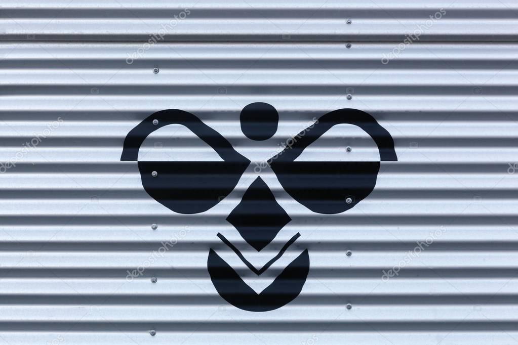 Aarhus, Denmark - November 12, 2016: Hummel logo on a wall. Hummel International is a sportswear company based in Denmark