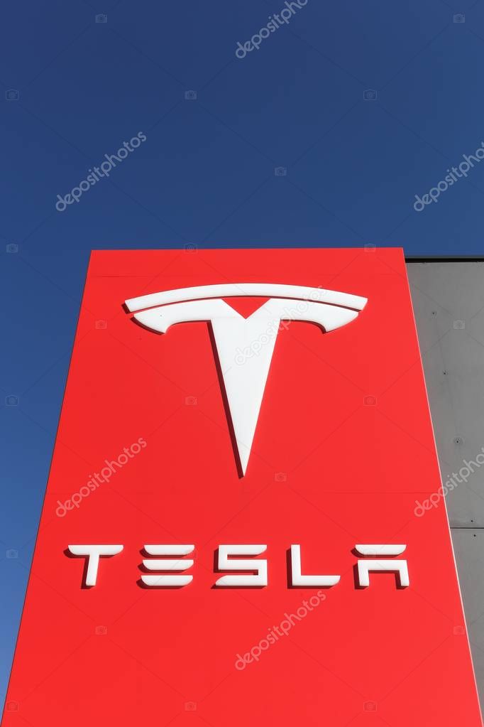 Tilst, Denmark - March 26, 2017: Tesla logo on a wall. Tesla is an American automotive and energy storage company that designs, manufactures, and sells luxury electric cars