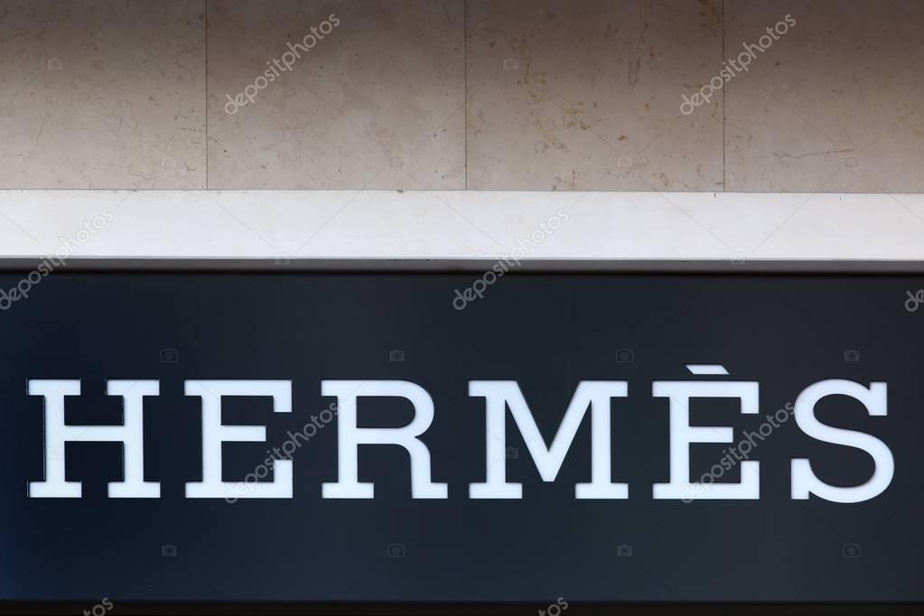 Geneva, Switzerland - August 14, 2017: Hermes logo on a wall. Hermes is a French high fashion luxury goods manufacturer established in 1837