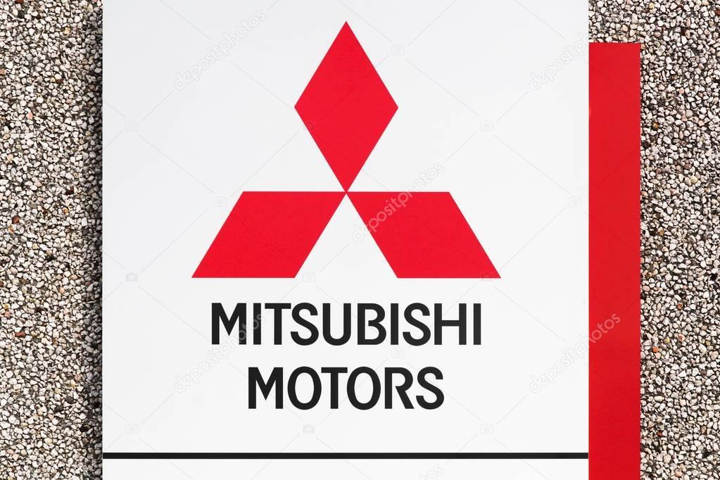 Skanderborg, Denmark - October 21, 2017: Mitsubishi logo on a wall. Mitsubishi Motors Corporation is a multinational automotive manufacturer headquartered in Tokyo, Japan