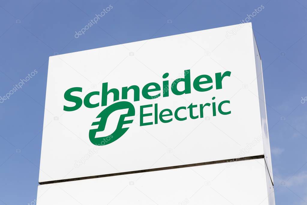 Grenoble, France - June 24, 2017: Schneider Electric logo on a panel. Schneider Electric is a European multinational corporation, leader in automation and electricity management