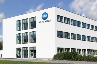 Ballerup, Denmark - September 10, 2017: Konica Minolta office building. Konica Minolta is a Japanese technology company. The company manufactures business and industrial imaging products clipart