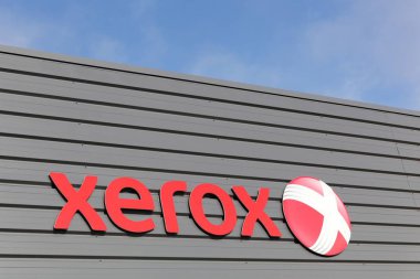 Dax, France - June 5, 2017: Xerox sign on a wall. Xerox is an American global corporation that sells business services and document technology products like office printers and scanner copiers clipart