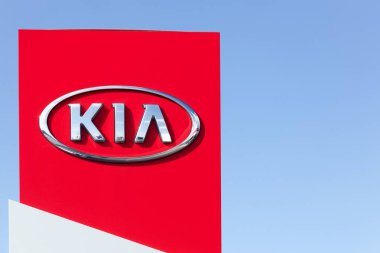 Holme, Denmark - September 20, 2015: Kia Motors sign on a panel of a dealership. Kia Motors Corporation headquartered in Seoul, is South Korea's second largest automobile manufacturer  clipart