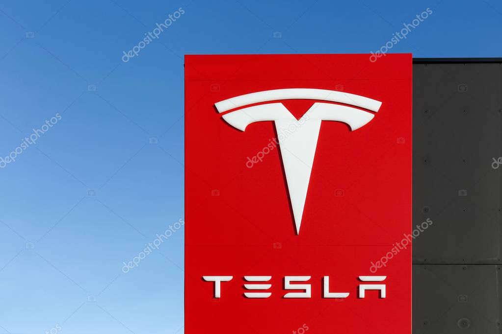 Tilst, Denmark - February 14, 2016: Tesla logo on a wall. Tesla is an American automotive and energy storage company that designs, manufactures, and sells luxury electric cars