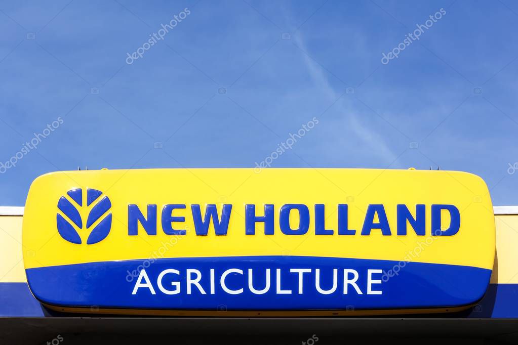 Norremarken, Denmark - March 25, 2017: New Holland Agriculture logo on a facade. New Holland is a brand agricultural equipment manufactured by CNH Industrial