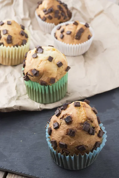 Muffins with chocolate on a stone tray — Stock Photo, Image