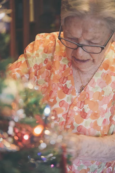 Senior woman stealing candy cane