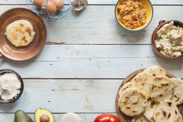 Arepas with reina pepiada and egg perico — Stock Photo, Image