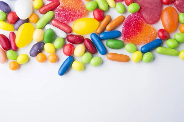Border of colorful jelly candies on white — Stock Photo, Image