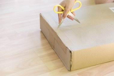woman unpacking a box
