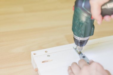 woman screwing screw real scene