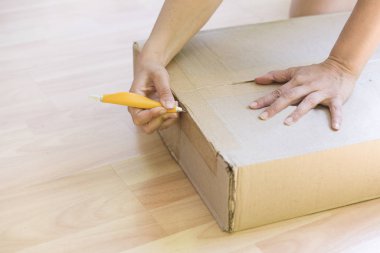 woman unpacking a box