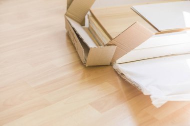 woman unpacking a box